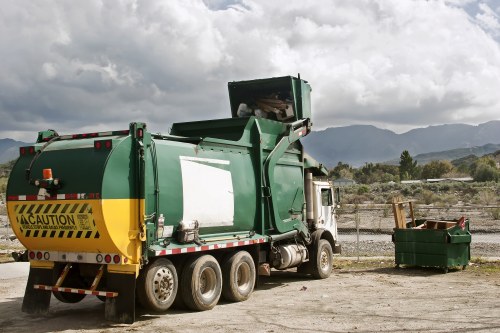 Workers managing office clearance with equipment